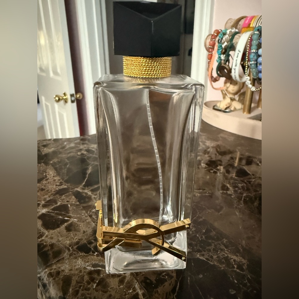 Elegant Gold and Black YSL Perfume Bottle